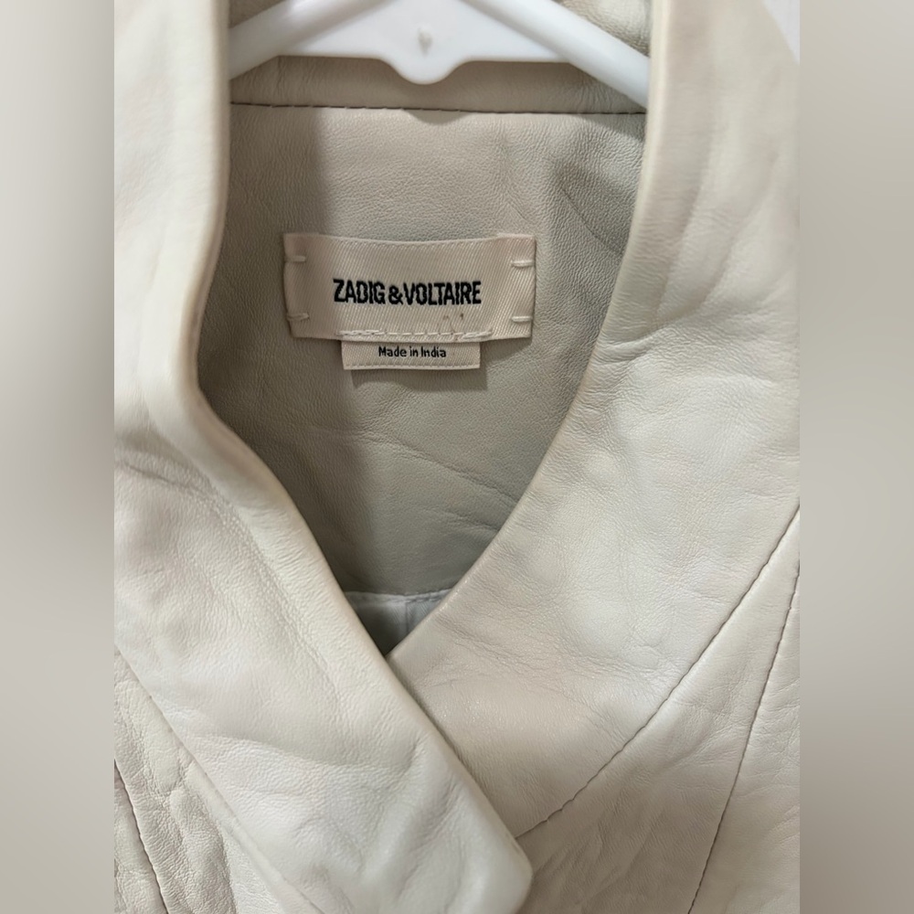Brand new beautiful jacket.  A tinge too small for me. Never worn.